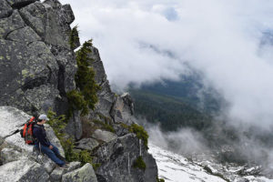 imager of Mike Guzman -Sitting on-mountain-side